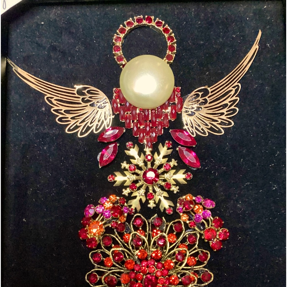 Angel Cynthia, she is done in gold and reds on black velvet